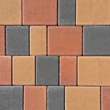 A detailed view of Barleystone 60mm Castlepave Smooth Maple reveals a geometric pattern of square and rectangular paving stones in shades of red, orange, beige, and gray, arranged in a repeating interlocking design.