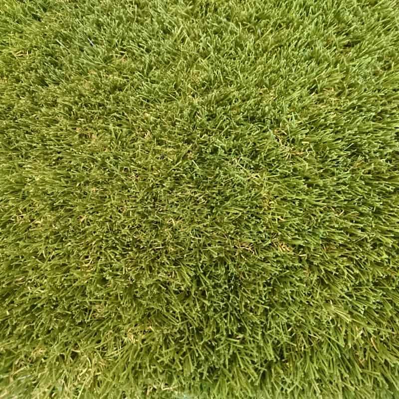 Close-up of 35mm Tri-Colour Artificial Grass in vibrant green, showcasing a dense, well-maintained lawn appearance and advanced spring-back technology.