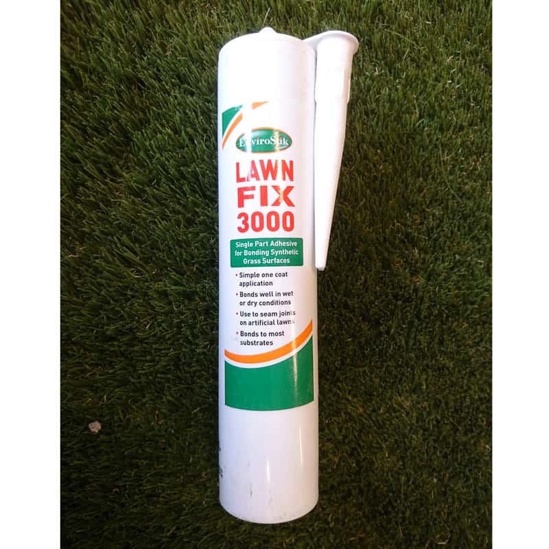 A white tube labeled as Lawn Fix 3000 Glue Cartridge lies on grass, highlighting its use as a single-part adhesive for synthetic grass. It promises easy application, effective performance in wet conditions, and is perfect for artificial lawns.