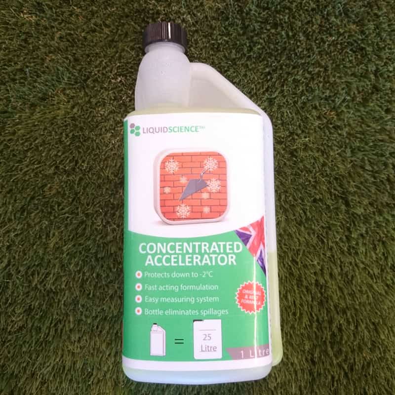 A 1ltr Bottle Accelerator rests on the grass, featuring a distinctive brick wall graphic. The label highlights protection down to -2°C, a fast-acting formula, an easy measuring system, and spillage elimination.