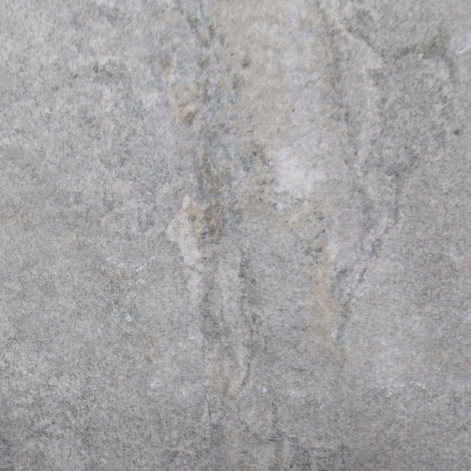 A close-up of the Gaja Italian Silver Mist Porcelain 600x600x20mm, showing a gray stone surface with light beige and white streaks, resembling Italian marble with a rough, natural texture.