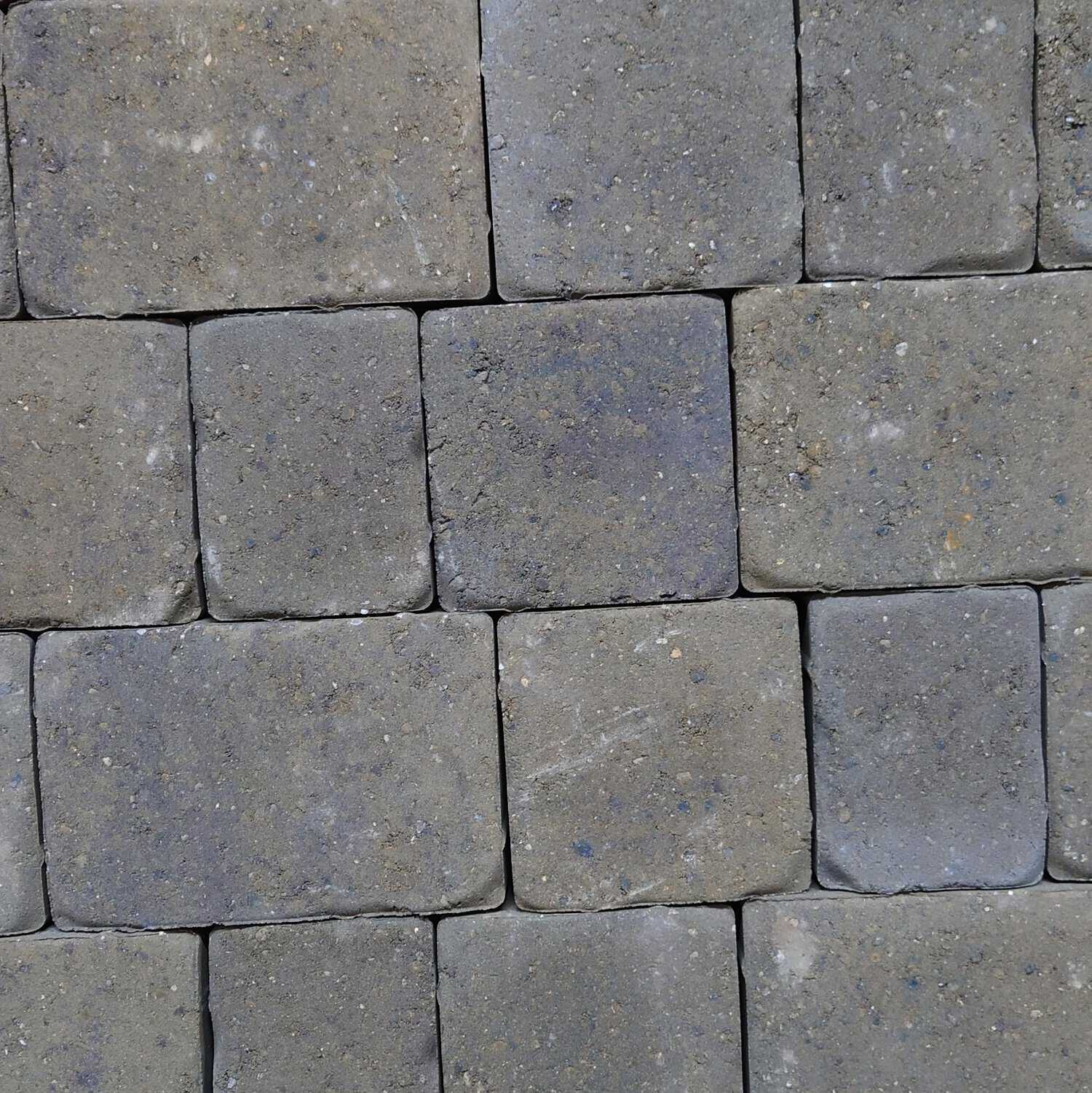 Close-up of Cemex 50mm ReadyPave CAMDEN Burnt Elm gray concrete pavers arranged in a uniform, offset grid. The surface is slightly textured, showing minor variations and specks.